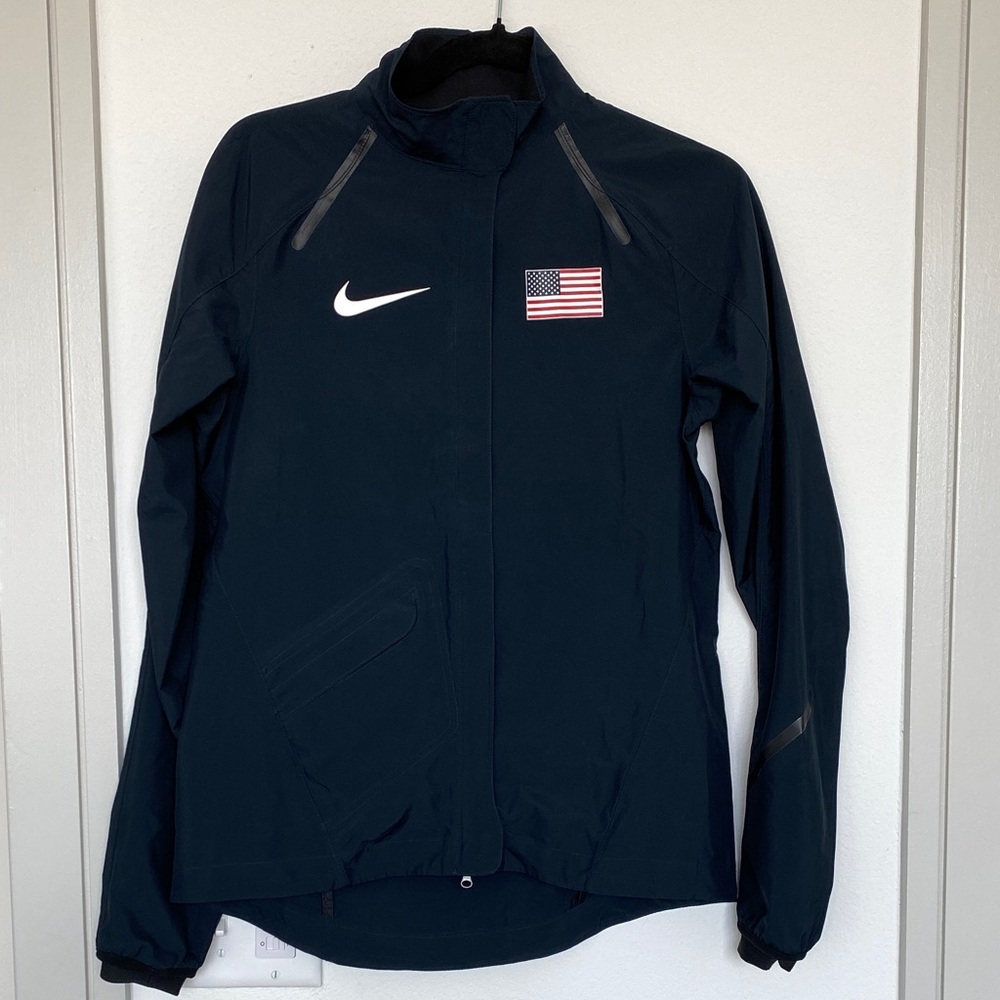 Nike Women's windbreaker and backpack bundle.